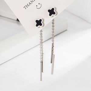 Silver four leaf clover tassel earrings with long drop pendant on white display card