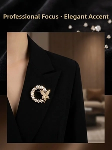 Close-up of pearl butterfly brooch on a black suit blazer lapel for elegant business style