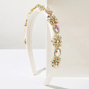 Macro view of white baroque headband with AB colorful rhinestones and floral crystals