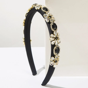 Detailed macro shot of Baroque wide headband with colorful crystals and gold metal settings