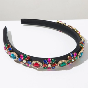Detailed macro view of vibrant colorful crystals on a black padded Baroque headband