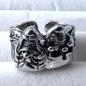 Macro shot of retro gothic open ring featuring detailed dual shark head design on silver