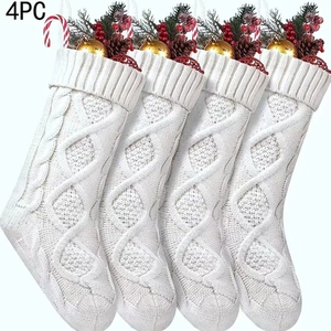 Detail view of 4 pack white cable knit Christmas stockings with pine cones and berries