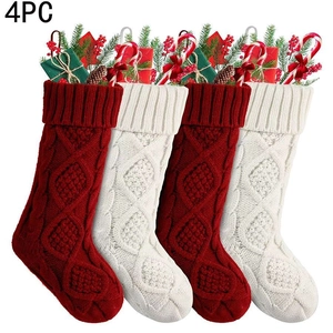 Detail of 4-pack knit Christmas stockings with pine cones and festive ornaments