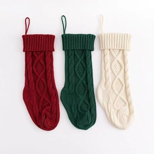 Close-up of cable knit textures on red, green, and white 53cm large Christmas stockings