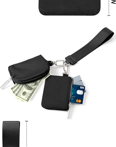 Detail of black nylon dual pouch wallet with metal carabiner and wrist strap