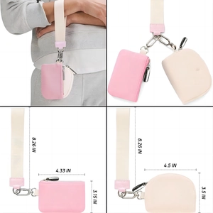 Detail of pink and cream mini nylon pouches with dimensions and metal hook on wristlet