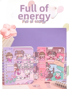 Detail of spiral bound notebook showing cute cartoon girl and rabbit cover illustrations