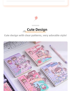 Close-up of cute spiral notebooks with cartoon girls and pastel index dividers