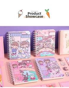 Detail of cute pastel spiral notebooks with cartoon illustrations and writing paper
