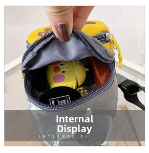 Internal storage view of colorful kids dinosaur canvas bag with small accessories