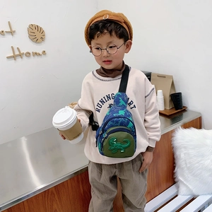 Kids blue canvas chest bag with cartoon dinosaur pattern and 3D applique detail