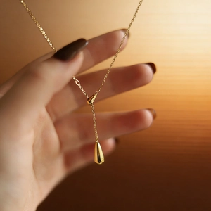 Elegant gold titanium steel teardrop pendant necklace with a sleek Y-shaped drop design