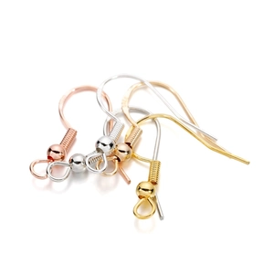 Detailed view of S925 sterling silver earring hooks in rose gold and yellow gold finishes