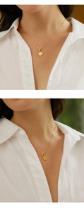 Detail of 925 sterling silver OT buckle necklace with a vintage coin queen pendant