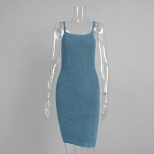 Close-up of the ribbed knit fabric texture and slim straps on a bodycon mini dress
