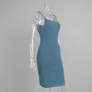 Detail of the blue ribbed knit dress fabric and side silhouette on a display mannequin