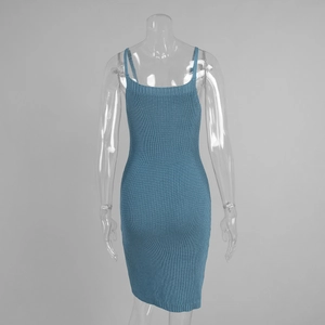 Detail of blue ribbed knit bodycon dress showing fine vertical texture and slim straps