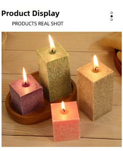 Detailed macro view of burning ice-textured pillar candles in various elegant colors
