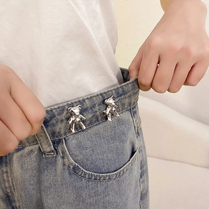 Silver bear waist buckle for jeans adjustment shown on denim trousers waist