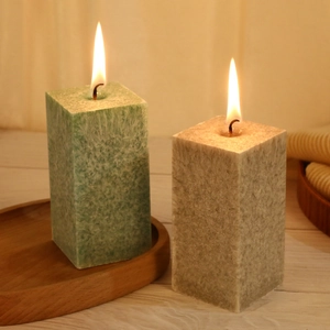 Scented pillar candles with ice crystal texture in light green and grey colors