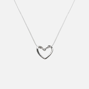 Minimalist silver hollow heart pendant necklace with sleek snake chain on grey background