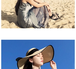 Detail of wide brim straw hat with black bow ribbon and wavy edges for beach sun protection