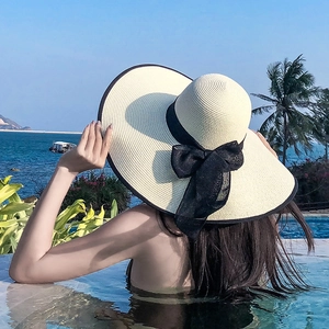 Women wide brim straw sun hat with black bow ribbon for beach vacation UV protection