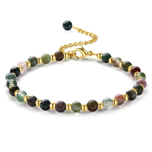 Close-up of beaded stone bracelet with gold spacers and adjustable lobster clasp chain
