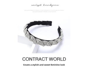Detail of cross twisted headband with white crystal rhinestones on black fabric base