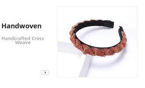 Close-up of handwoven rhinestone headband featuring red crystals and cross braided texture
