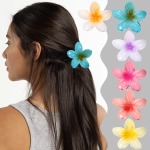 Frangipani flower hair claws in six gradient colors shown with model wearing blue clip