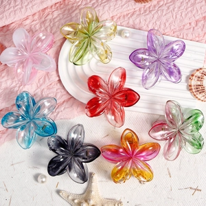 Set of eight colorful frangipani hair clips with translucent resin petals and metal springs