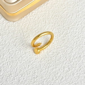 Polished gold-plated stainless steel nail ring with a classic minimalist wrap design