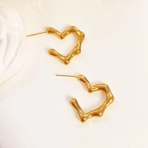 Elegant gold irregular heart earrings with textured lava finish in minimalist style