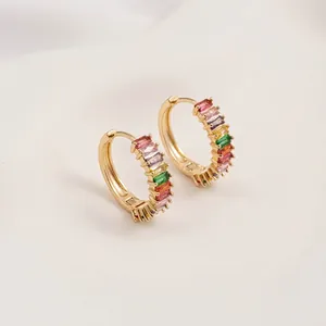 Detail of 14K gold plated hoop earrings with colorful baguette-cut rainbow zircons