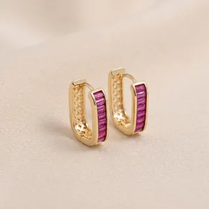 Detailed close-up of 14K gold-filled rectangular earrings with pink zircon stones