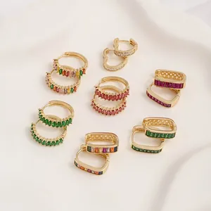 Close-up of 14K gold plated hoop earrings with vibrant colorful cubic zirconia inlays