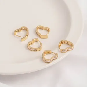 Elegant 14K gold plated heart earrings with rectangular cubic zirconia on white tray
