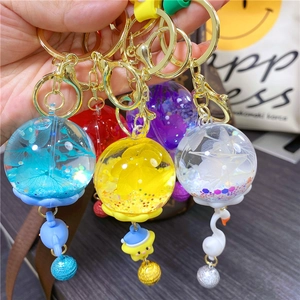 Handmade luminous dried flower jellyfish keychain with blue whale and star charms