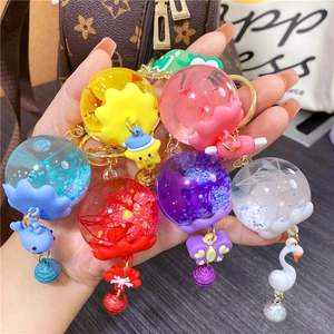 Luminous dried flower jellyfish keychain with liquid quicksand and colorful star charms