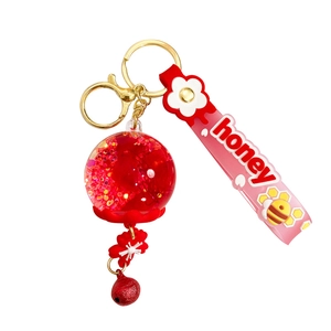 Luminous dried flower liquid glitter keychain with honey wrist strap and red bell