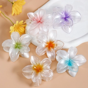 Set of six colorful plumeria flower hair claws with pearlescent finish and gradient colors