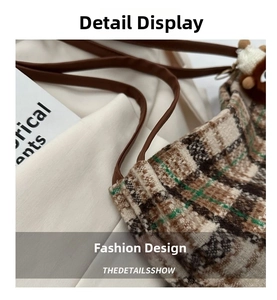 Detail of tweed checkered tote bag with leather strap and bear plush charm