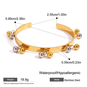 Two-tone geometric open bangle with gold and silver bell charms in stainless steel