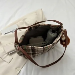 Canvas plaid tote bag with spacious interior showing wallet, phone, and umbrella capacity