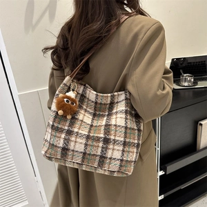 Classic plaid canvas tote bag for women with soft texture and a plush ball pendant