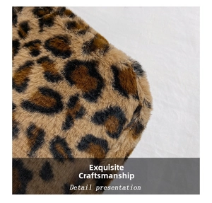 Detail showing the thick leopard print plush faux fur texture and neat stitching of the bag