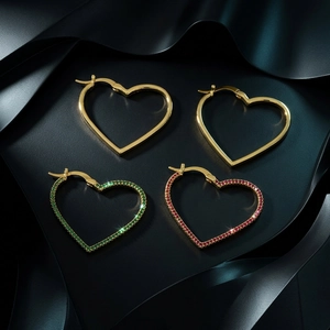 Elegant gold hollow heart hoop earrings set with sparkling red and green gemstones