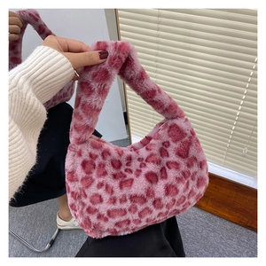 Detailed view of pink leopard print faux fur handbag with soft plush texture and wide handle